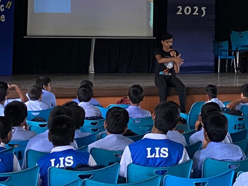 Tharindu speaking to students during a session at Louvre College
